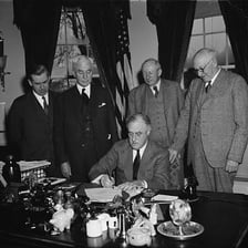 Officials signing an international trade agreement