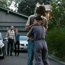 A couple sharing an emotional goodbye