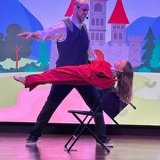 A magician performing a stage magic trick