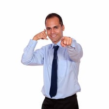 A person pointing toward something in the distance