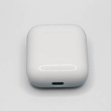 Apple AirPods resting in their charging case.