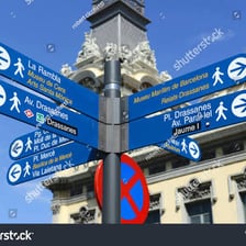 A street scene in Barcelona with Spanish or Catalan signage
