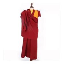 A Tibetan Buddhist lama wearing traditional robes