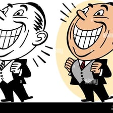 A person smiling broadly with a visibly joyful expression.