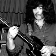 Tony Iommi performing guitar with Black Sabbath