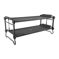 Individual folding cots arranged in a sleeping area