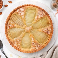 A baked pear tart topped with sliced pears