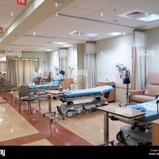 Hospital recovery area with beds for patients after surgery