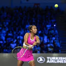 Professional women’s tennis players competing in a match.