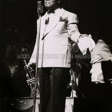 Louis Armstrong performing as a jazz singer.