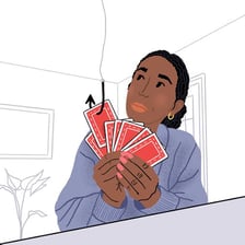 A player drawing a card during a game of Go Fish.