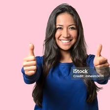 A person expressing enthusiastic approval with a thumbs-up gesture