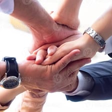 A person being welcomed into a group.