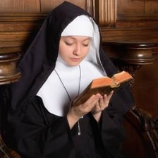 A Catholic nun standing inside a church.