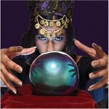 A fortune teller viewing a crystal ball