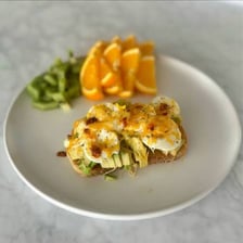 A browned slice of toast topped with food
