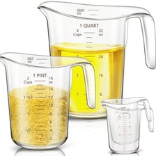 A measuring container marked with liquid volume units.
