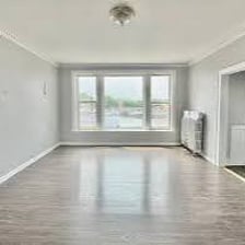 An empty apartment awaiting a tenant.