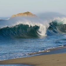 A large wave approaching a coastline