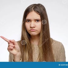 A person gesturing a denial by shaking their head
