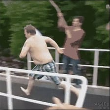 A diver landing belly-first in the water and making a large splash