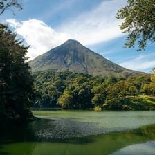 A tropical Costa Rican landscape with rainforest and a volcano