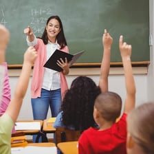 A teacher instructing students in a classroom