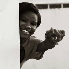 A portrait of a woman representing the pronoun she.