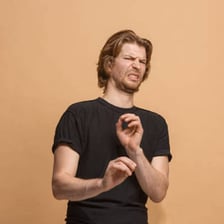 A person making a disgusted reaction