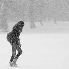 A person trudging forward with heavy steps
