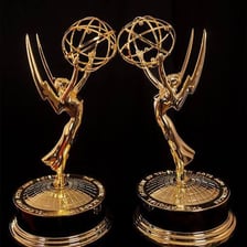 A golden Emmy Award statuette.
