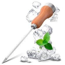 A metal ice pick being used to chip ice.