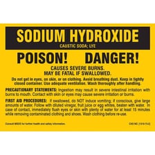A labeled container of lye with chemical safety symbols
