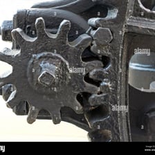 A close-up view of the teeth, or cogs, on a metal gear.
