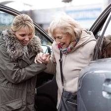 A person helping another person as an example of virtuous behavior.