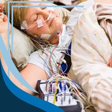 A patient undergoing monitoring during a sleep study