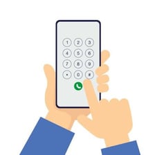 A person dialing a number on a smartphone.
