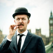 A casually dressed British man.