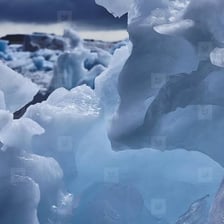 A close-up of ice melting into water.