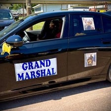 A champion being honored during a public celebration