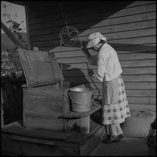 A person reaching to retrieve an object.