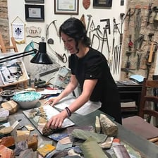 An artisan creating a crafted object.