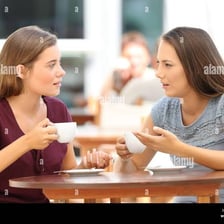 People talking casually together at a cafe