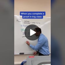 A mathematical proof on a chalkboard ending with the traditional QED notation.