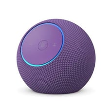 An Amazon Alexa smart speaker on a table.