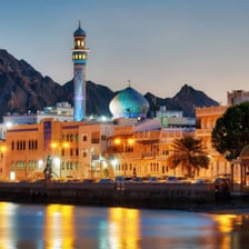 A view of Muscat, Oman, with the city and surrounding mountains