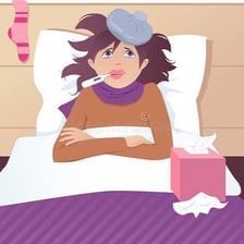 A person with cold symptoms beside tissues and a thermometer