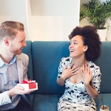 A person accepting an offered gift.