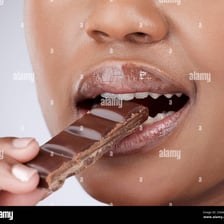 An appealing dessert being offered to tempt someone