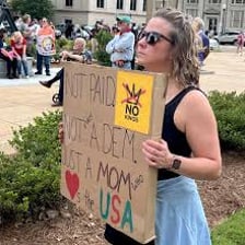 A protester demonstrating opposition to a policy.